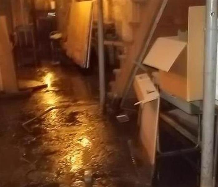Basement with items and standing water