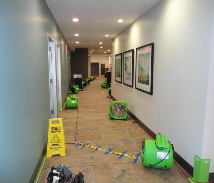 Dental office hallway with SERVPRO drying equipment