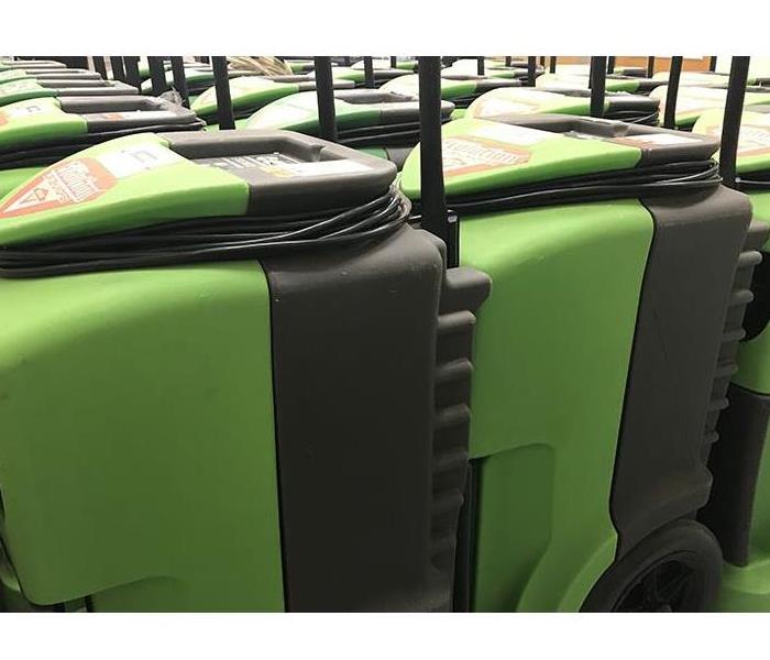 SERVPRO Drying Equipment lined up in a room.