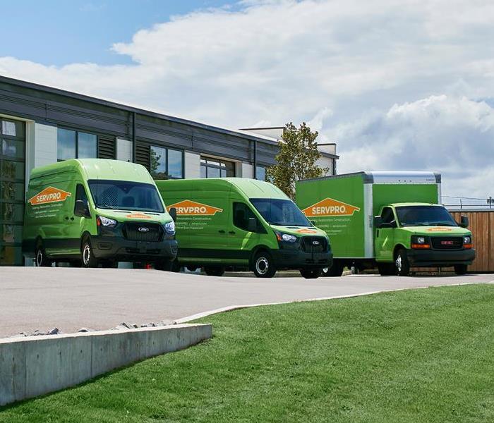SERVPRO vehicles in a parking lot.