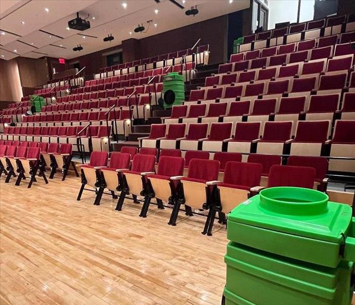 An auditorium with air purification and deodorization equipment set up.